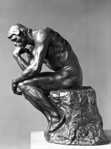 The Thinker (French: Le Penseur) is a bronze sculpture by Auguste Rodin, usually placed on a stone pedestal. The work shows a nude male figure of over life-size sitting on a rock with his chin resting on one hand as though deep in thought, often used as an image to represent philosophy.